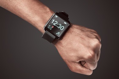 human hand wearing smart watch. wearable gadget concept