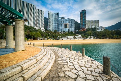 pier and skyscrapers at repulse bay, in hong kong, hong kong.