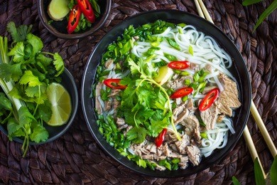 traditional vietnamese  soup pho with beef and rice noodles, top view