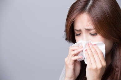 a woman catches a cold, illness, asian