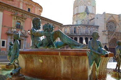 valencia plaza de la virgen square and neptune fountain statue in spain