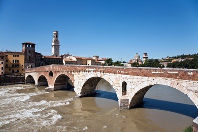 the old roman bridge in verona  spans the river etsch