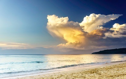 sunset on a sea beach with fantastic sky clouds. twilight reflection phuket, thailand. amazing sunset vacation in asia. soft sunset reflection in sea water, karon beach phuket. exotic sea view at dusk