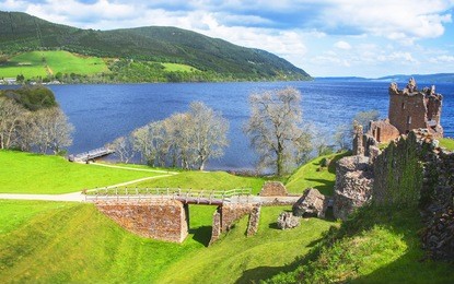 panoramic view to ruins of urquhart castle in loch ness in scotland. loch ness is a city in the highlands in scotland in the united kingdom.