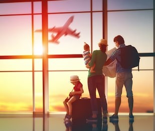 happy family with suitcases in the airport. 