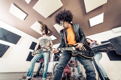 rock band playing hard rock in the studio. concept about entertainment and music