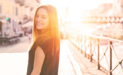 smiling happy girl looking back at camera