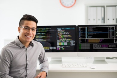 portrait of smiling vietnamese software engineer