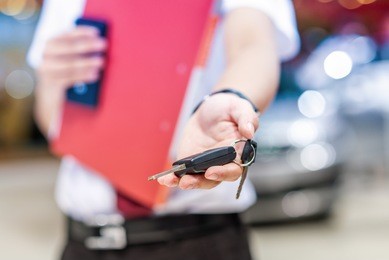 hand with a car keys. transportation. driving.