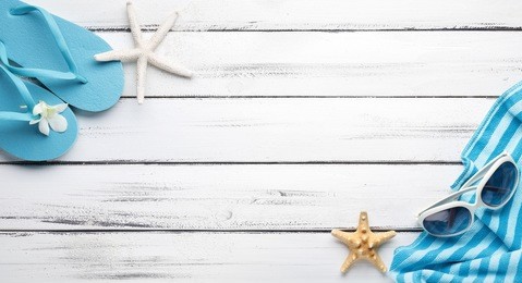towel and beach slippers on wood

,summer background.