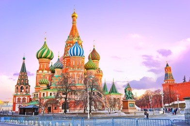 st. basil's cathedral and the kremlin on the red square in moscow at sunset