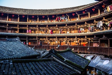 chinese fujian tulou and the surrounding scenery - on february 2016. fujian tulou 2008.7.7 was listed as a unesco world cultural heritage. a famous historical relic.