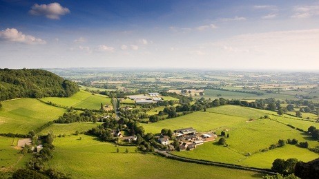 the view of the cotswold hills scarp and severn valley from frochester hill near stroud.