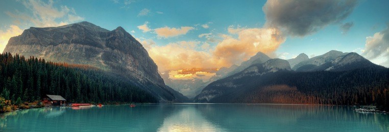 banff national park lake louise sunrise panorama with mountains and forest in canada.