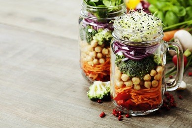healthy homemade mason jar salad with chickpea and veggies - healthy food, diet, detox, clean eating or vegetarian concept