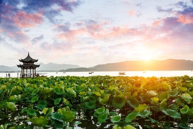 ancient pavilion of hangzhou west lake at dusk, in china