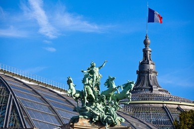 paris, the sculpture group on the top of the grand palace museum.