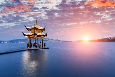 ancient pavilion of hangzhou west lake at dusk, in china