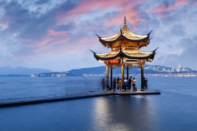 ancient pavilion of hangzhou west lake at dusk, in china