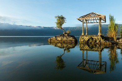 beautiful lake batur landscape overlooking serene and beautiful mount batur during blue sky cloudy day, bali indonesia.