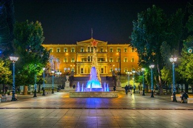 syntagma square with parliament building at the end in athens decorated for christmas