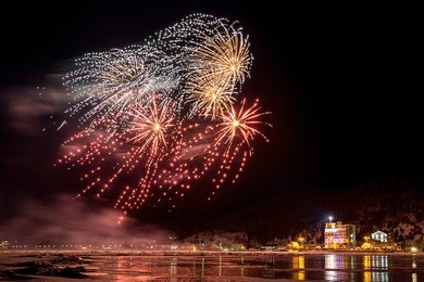 fireworks in village listvyanka on the shore of lake baikal, night