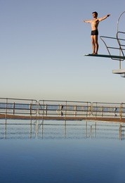 a diver standing on a diving board