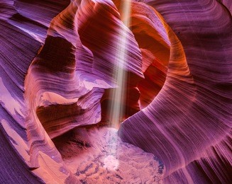 famous midday sun ray in a slot canyon antelope. the navajo reservation, arizona, usa