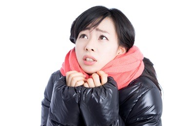 beautiful young woman wearing down jacket, isolated on white background