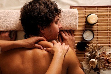 the young man on spa treatment - recreation,  rest,  relaxation and massage. high angle view