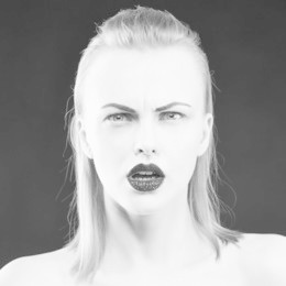 beauty face of caucasian blonde woman with party make up and hair style. glamour sparkle black lips. studio portrait. black and white