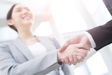 group of success business people team shake hands in office with city background, asian
