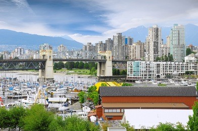 burrard bridge, yachts and boats by granville island public market. canada.