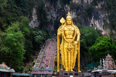 batu caves statue and entrance near kuala lumpur, malaysia