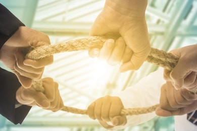 teamwork businessman team ,team people hold rope circle concept.