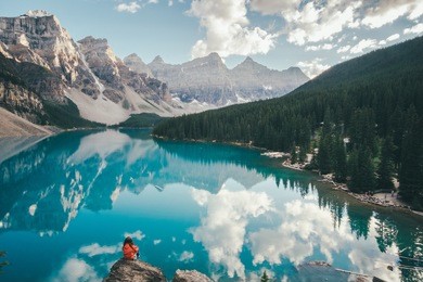 girl enjoying the view of moraine lake, canada