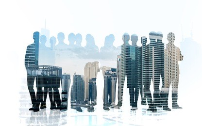 business, teamwork and people concept - business people silhouettes over city background with double exposure effect
