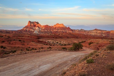 dirt road through the san rafael swell in the utah desert, usa.