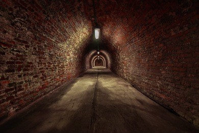 long underground brick tunnel angle shot
