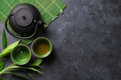 green japanese tea on stone table. top view with copy space