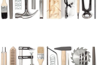 carpentry and woodwork tools on white background. carpenter working table. frame composition with copy space top view
