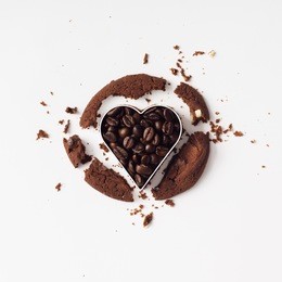 chocolate coffee cookie cut with heart cutter. flat lay. love concept.
