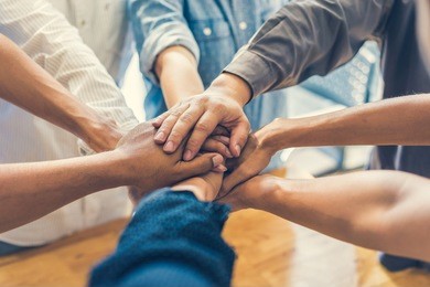 business people making pile of hands , soft focus, vintage tone 