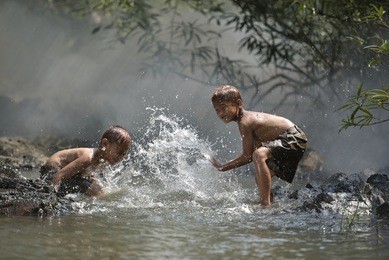 the fun of playing at the river .