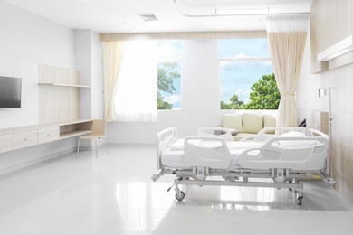 hospital room with beds and comfortable medical equipped in a modern hospital