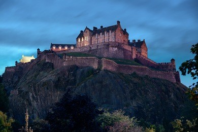 edinburgh castle with fountain as the famous city landmark. united kingdom.