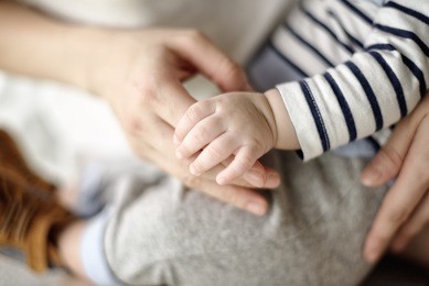 soft focus and blurry of baby and mother hands