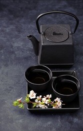 asian tea set on black background