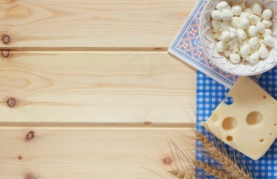 image of dairy products on wooden background. symbols of jewish holiday - shavuot
