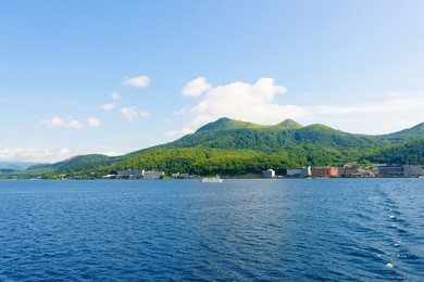 view of toya city from toya lake (toyako) in hokkaido, japan.